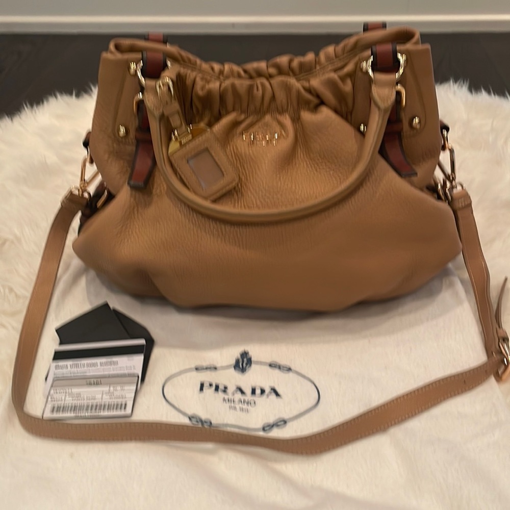 Prada, large bucket/cross body tote. Camel colour w/ cognac detailing
